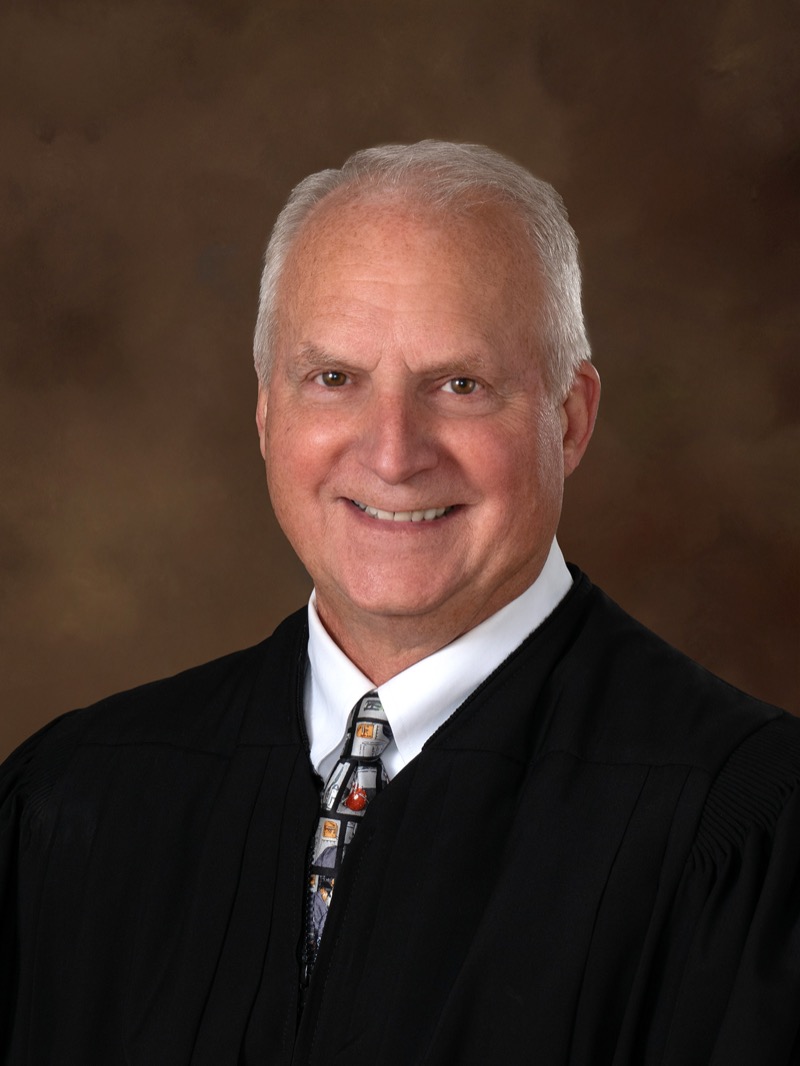 Portrait of Greg Rainville in judicial robes.